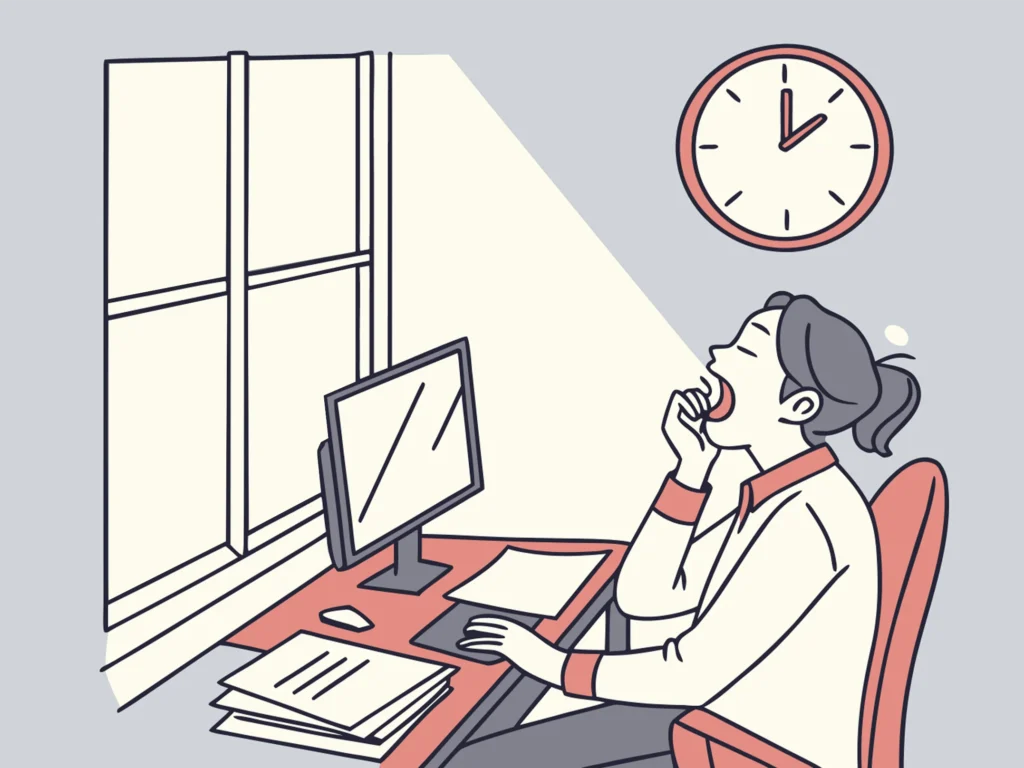 Person yawning at 3 PM desk.